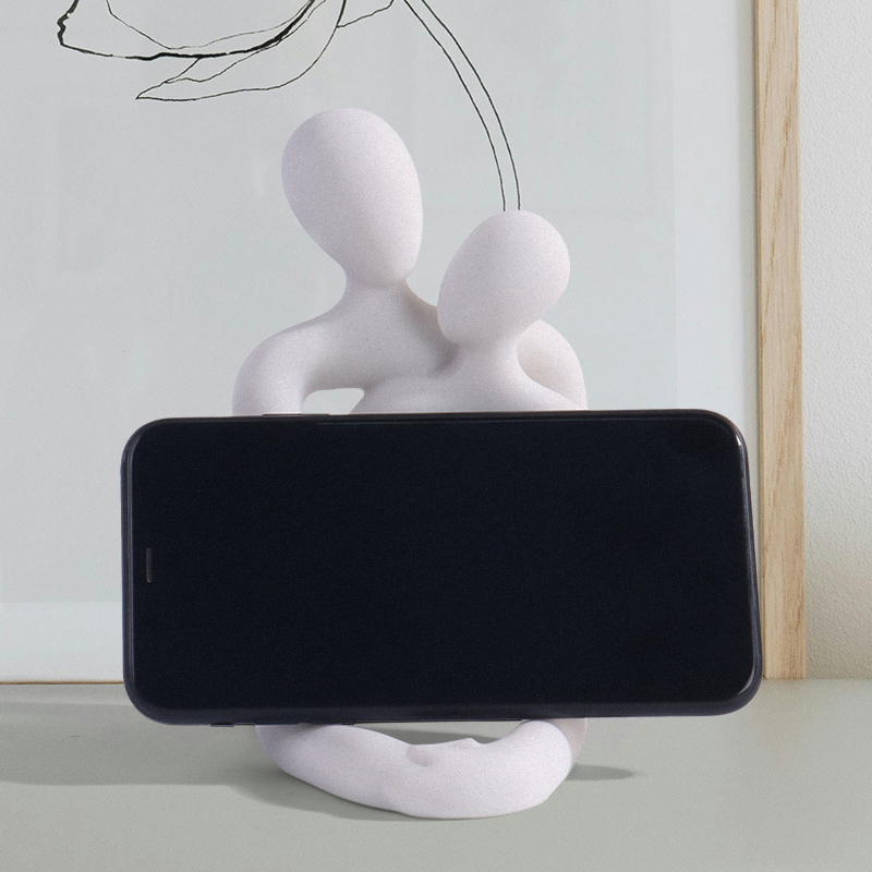 Couple embrace phone holder sc - Interior Design Book reseña y precio