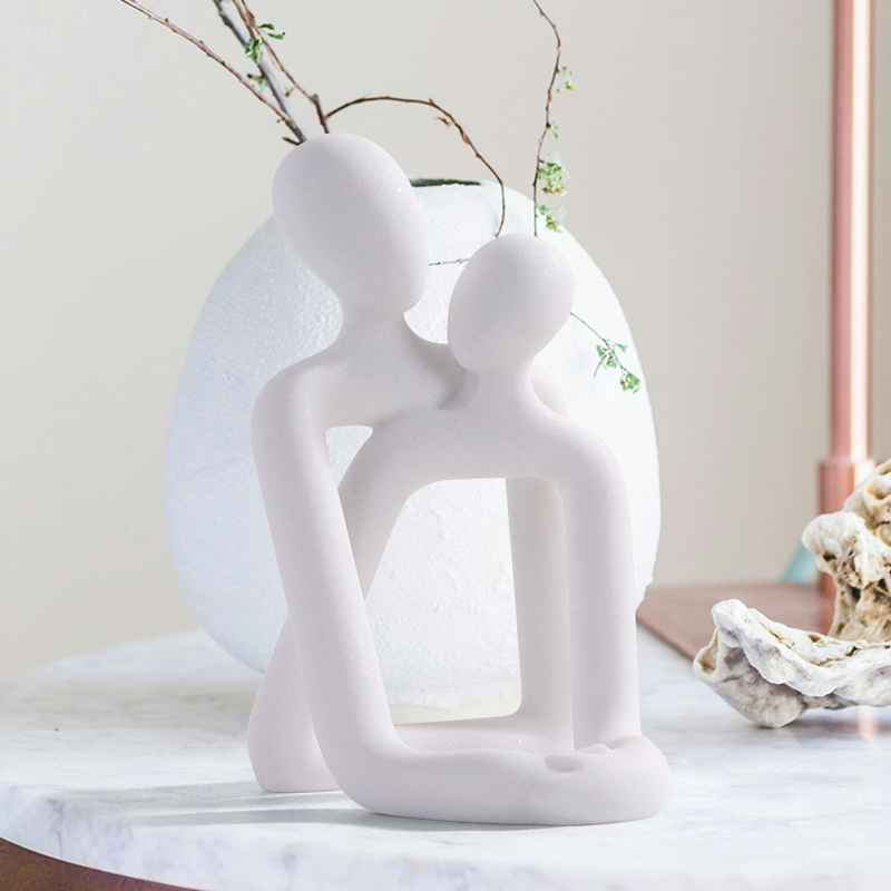 Couple embrace phone holder sc - Interior Design Book reseña y precio
